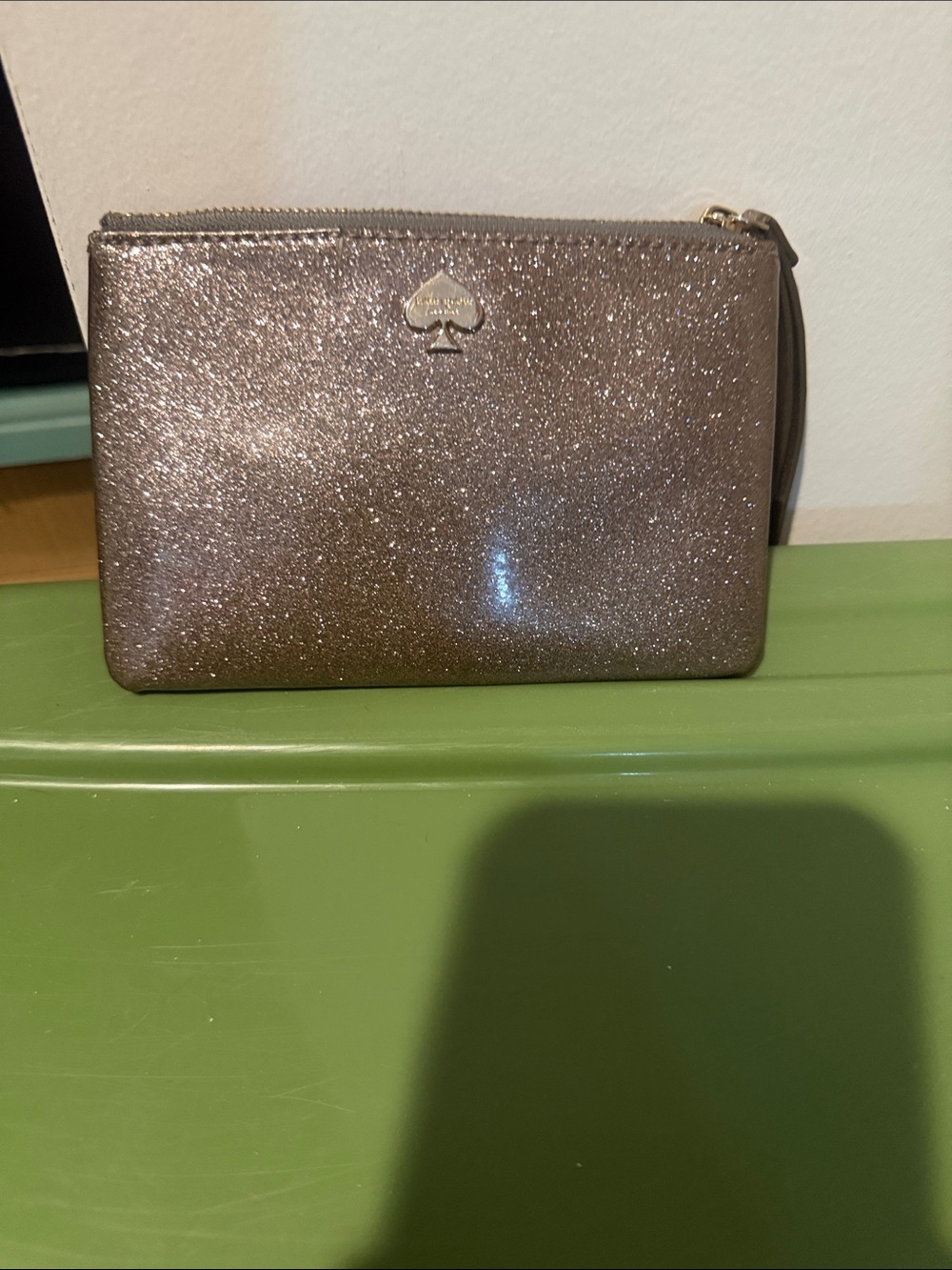 kate spade glitter wristlet in rose gold shimmer